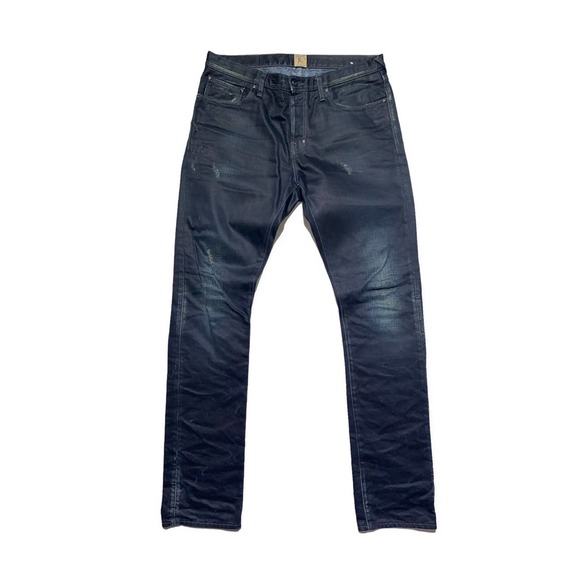 Coated dark wash slim denim